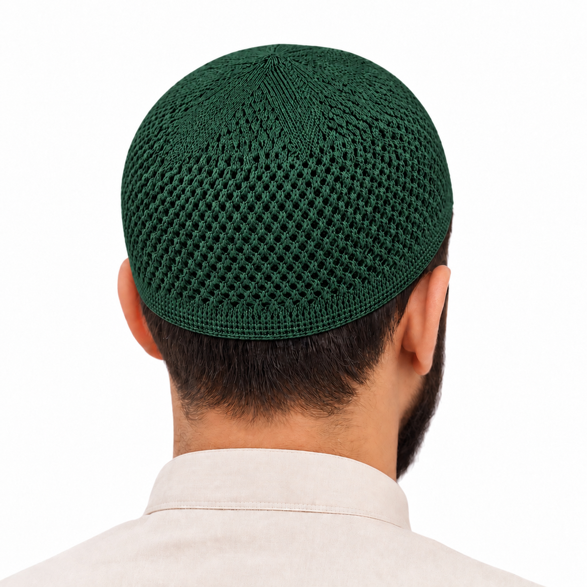 Dark green knit kufi worn, back view